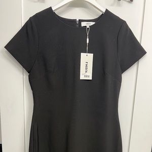 Likely black Manhattan dress
